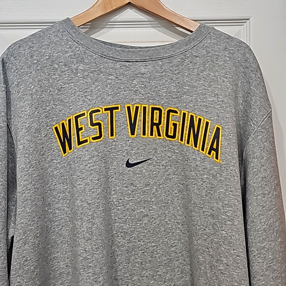 Brand New never worn WVU crew neck Nike sweat shirt.
